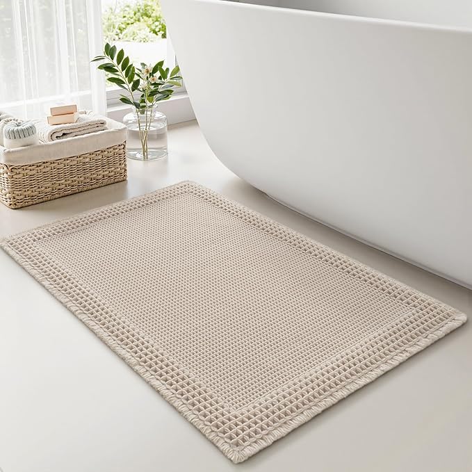 RESARE Waffle Bath Mat for Bathroom, Super Absorbent Bathroom Rugs Non Slip Machine Washable, Ultra Soft Quick Dry Boho Bath Rugs with Tassels for Floor, Upgraded Bordered Design, 24"x36" Pale Beige