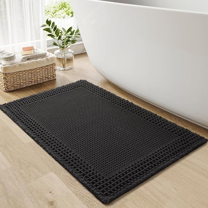 RESARE Waffle Bath Mat for Bathroom, Super Absorbent Bathroom Rugs Non Slip Machine Washable, Ultra Soft Quick Dry Boho Bath Rugs with Tassels for Floor, Upgraded Bordered Design, 17"x24" Black